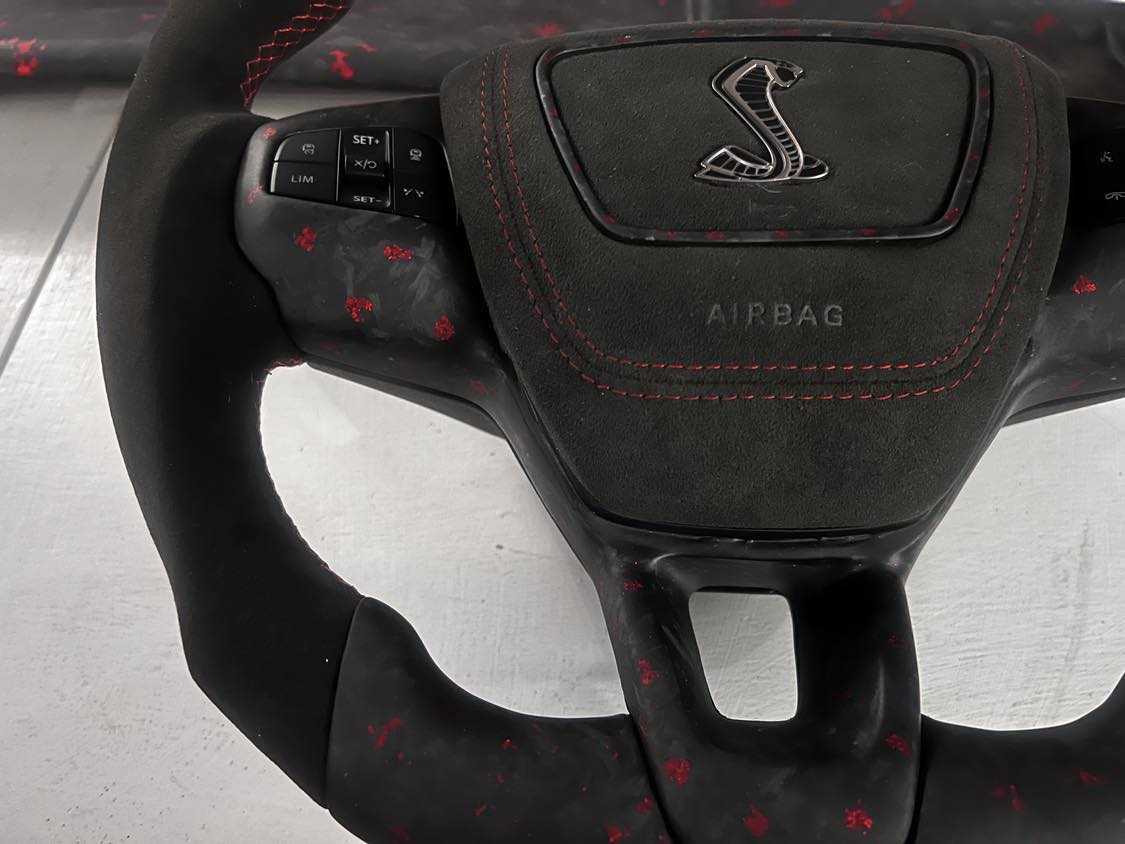 Custom made steering wheel for Mustang Mach-E with leather and Alcantara grips, flat-bottom design, and customizable features