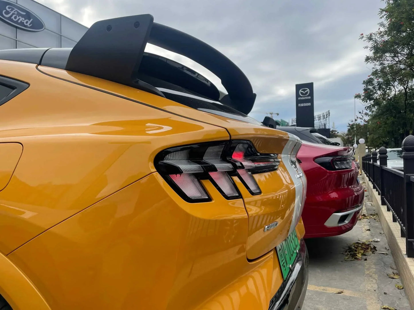 Rally Wing Spoiler installed on yellow Ford Mustang Mach-E rear for improved aerodynamics and sporty look