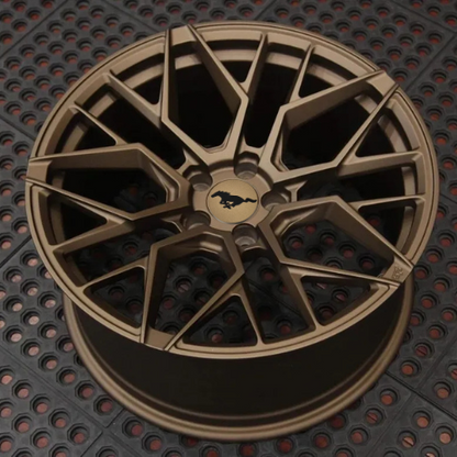 Bronze custom forged aluminum wheel for Mustang Mach-E with intricate multi-spoke design and Mustang logo center cap