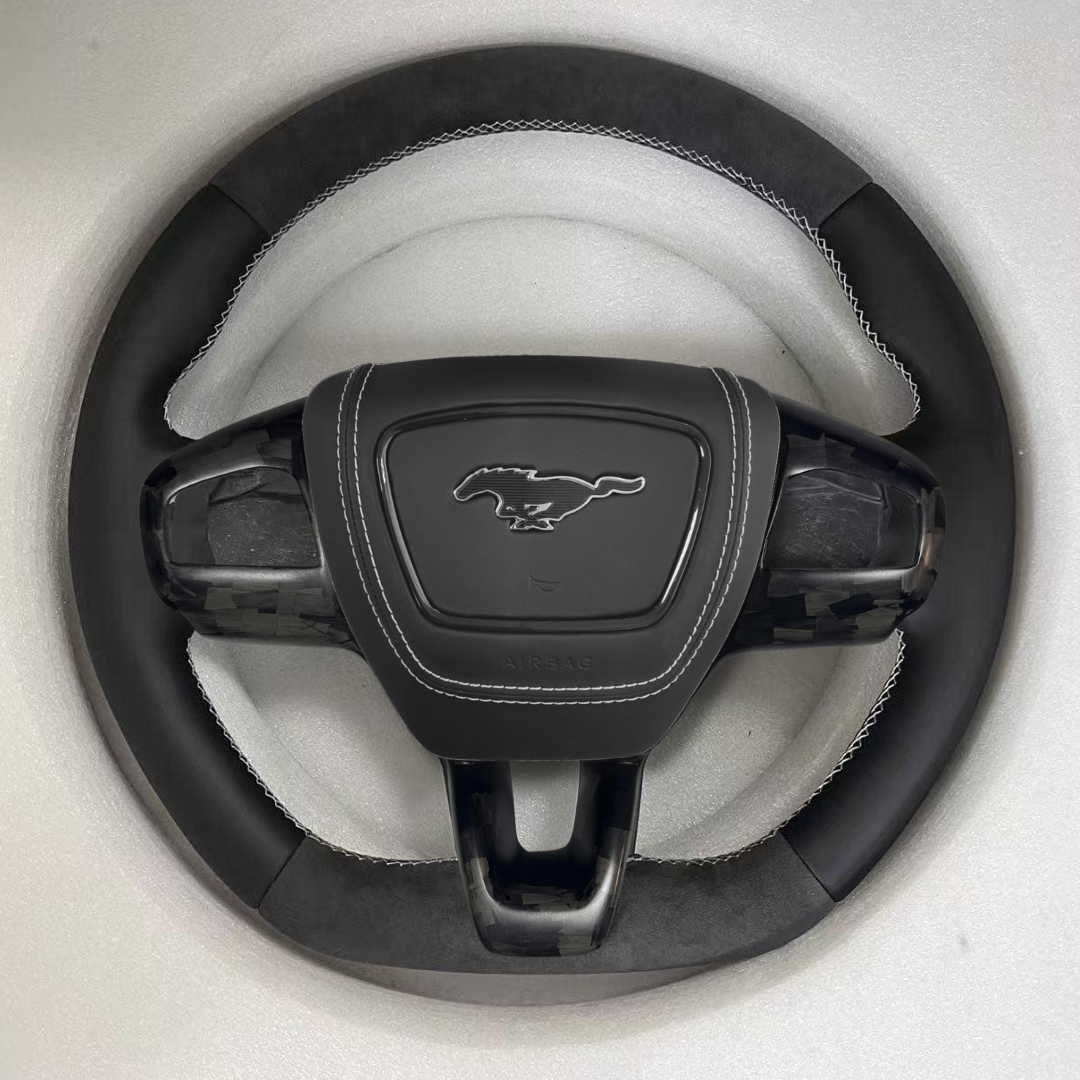 Custom made steering wheel for Mustang Mach-E with Alcantara grip and heated carbon fiber options