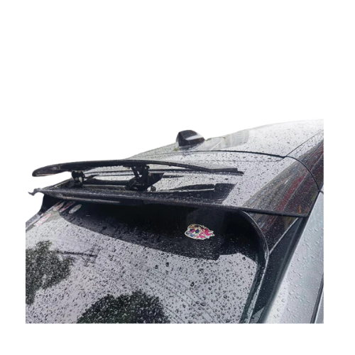 Retractable spoiler on rear of black Mustang Mach-E car in rain with sleek aerodynamic design