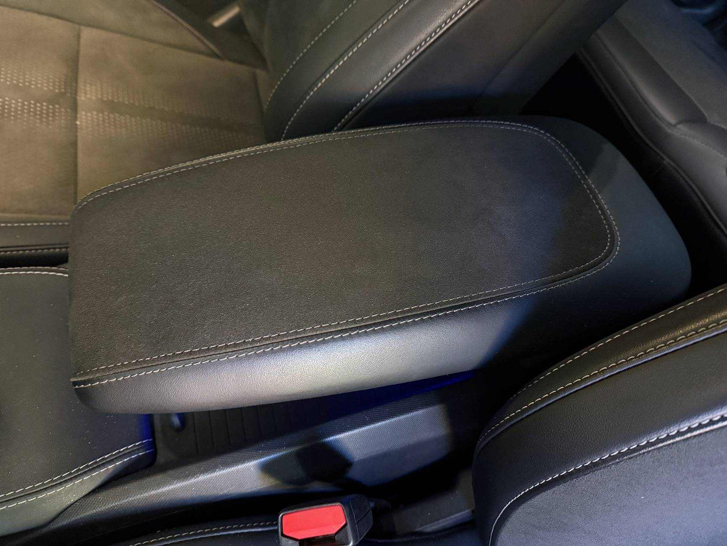 Custom-made armrest with Alcantara and leather, enhanced comfort, personalized stitching, and logo customization.